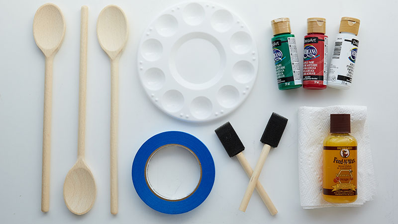 Wooden spoons, painter's tape, paints, sponge paint brushes, paint pallette