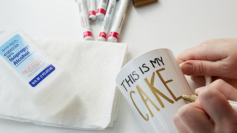 Use paint pens to write on the outside of the mugs 
