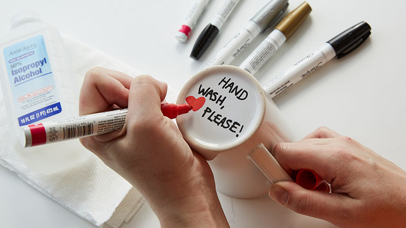 Use paint pens to write on the bottom of the mugs 