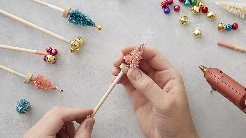 Attaching decorations to a wooden dowel