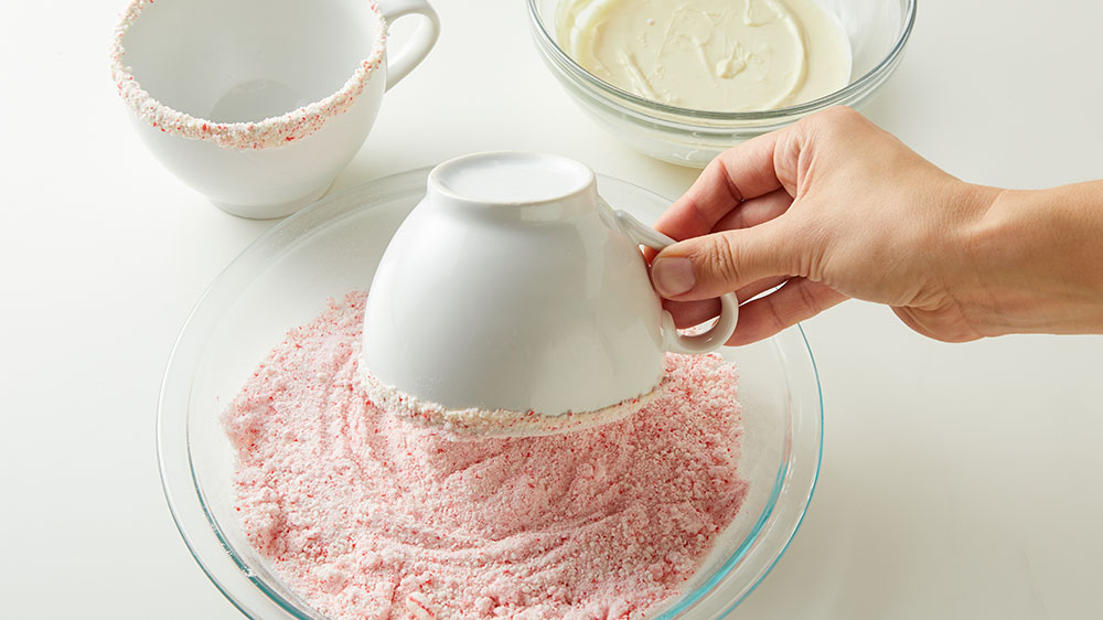 dipping tea cup in candy cane dust