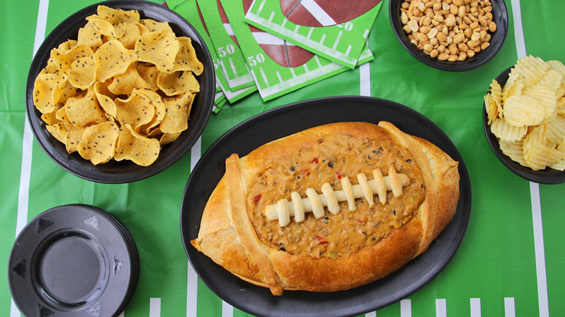 Taco Dip in a Football Bread Bowl