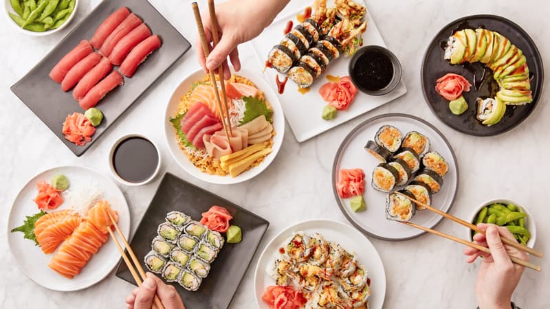 Big sushi set made of fresh vegetables and seafood Stock Photo by