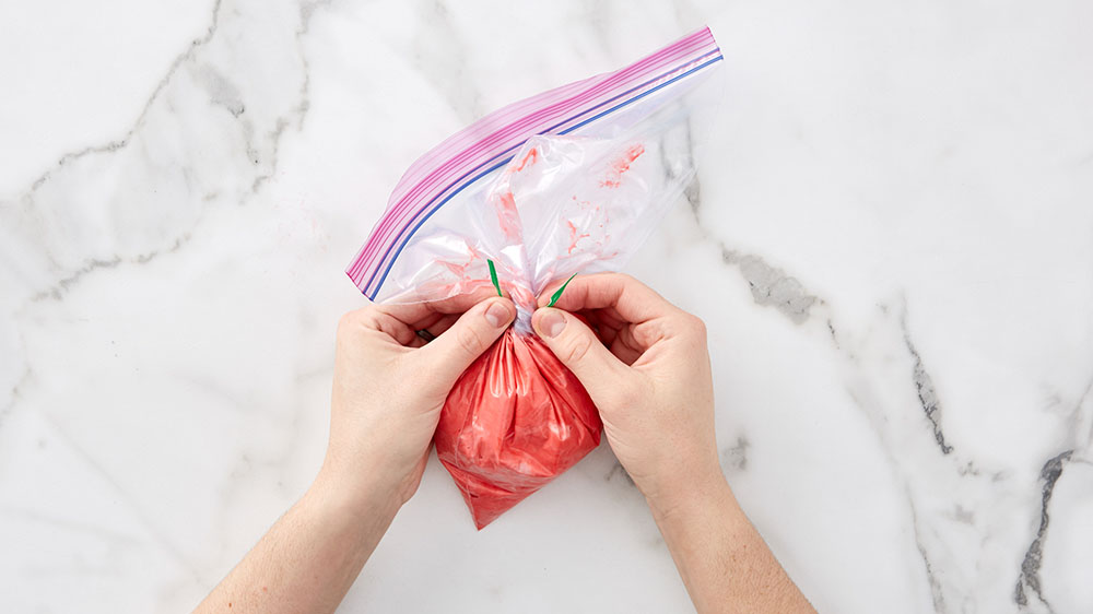 attached twist tie to ziploc bag with frosting