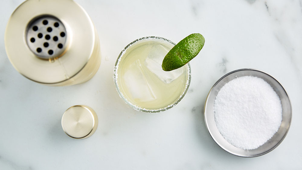 shaker, margarita and bowl of salt