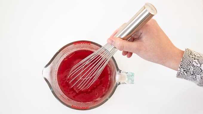 Whisk jello, water and alcohol.