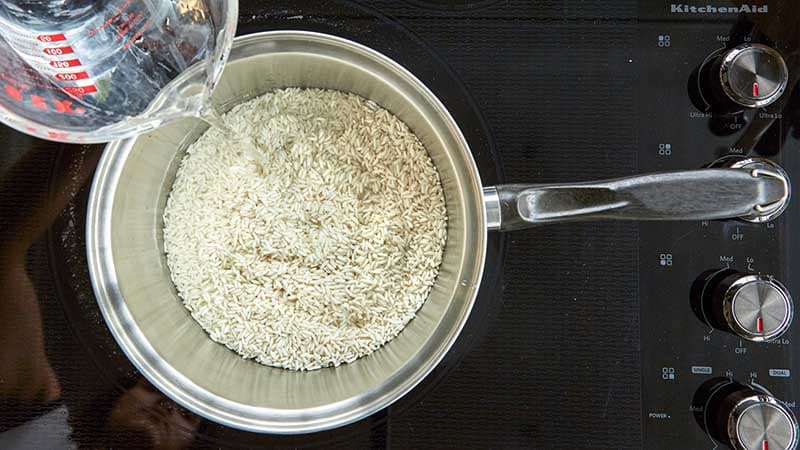 cover rice in two to three inches of water