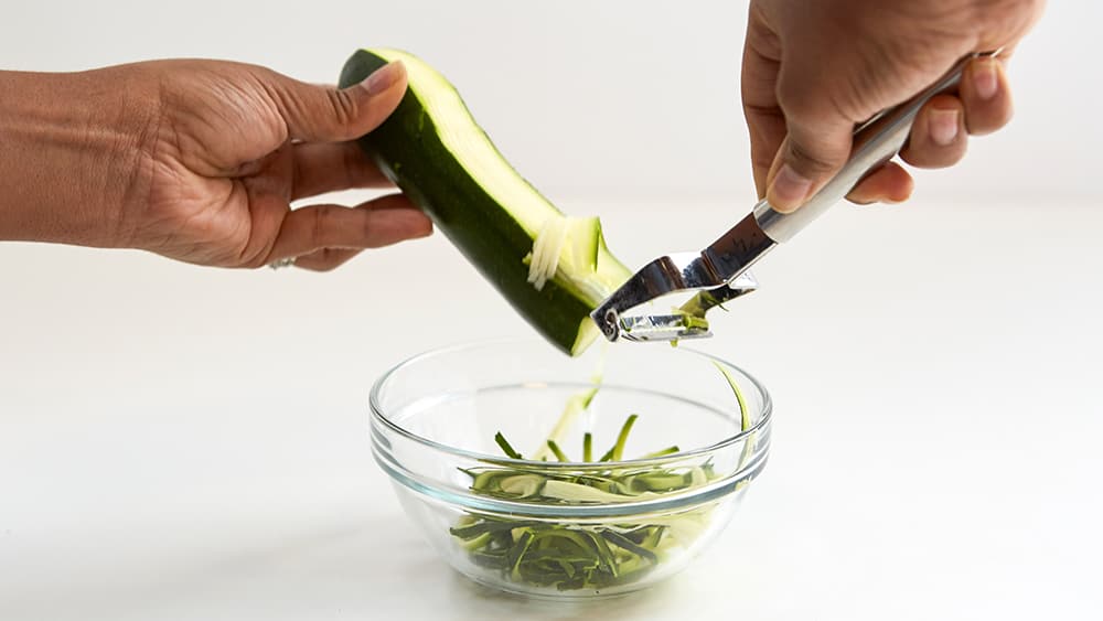 Making zoodles with a julienne peeler