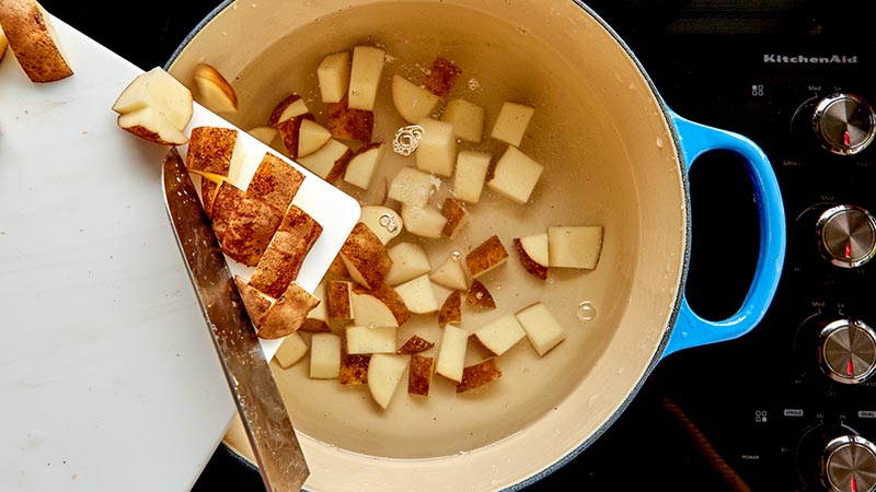 Put the potatoes in the pot and add enough cold water to completely cover them. 