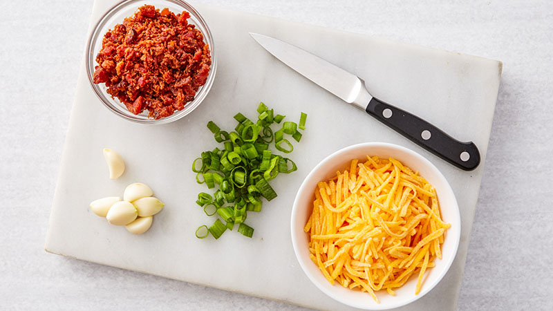 Chopped bacon, green onions, garlic, shredded cheese