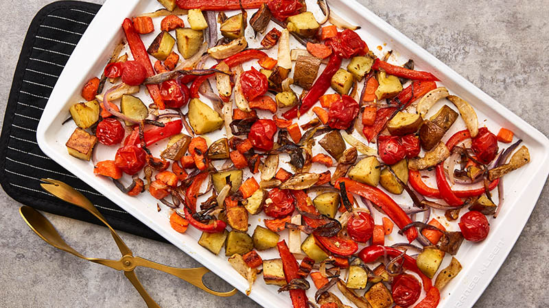 Roasted potatoes, carrots, onions, garlic, cherry tomatoes, parsnips
